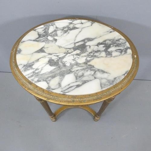 2018 - A French oval marble-topped occasional table, on gilt painted base, with carved and fluted decoratio... 