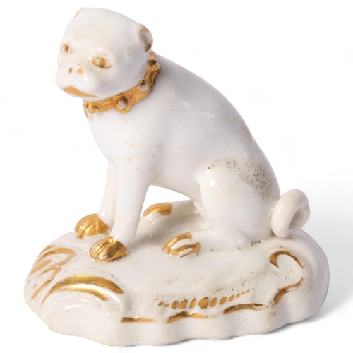 10 - Derby, a 19th century porcelain model of a Pug dog seated on its haunches, with a studded gilt colla... 