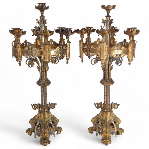 101 - A pair of Antique Gothic Revival gilt-metal 7-light table candelabras, having castellated bowls, flo... 