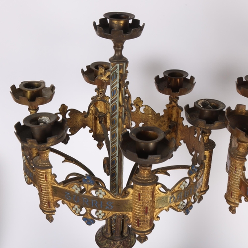 101 - A pair of Antique Gothic Revival gilt-metal 7-light table candelabras, having castellated bowls, flo... 