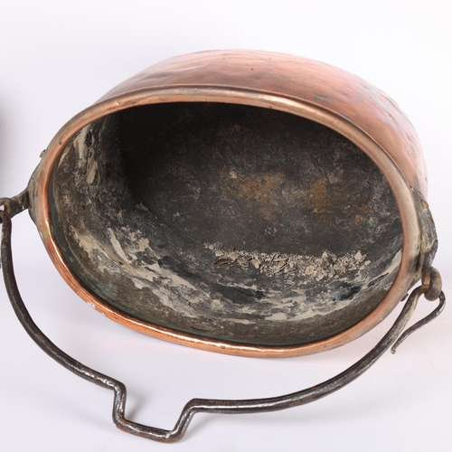 102 - A large Georgian copper coal bin and lid, with iron swing-handle, W47cm