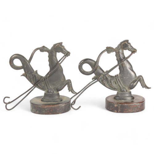 109 - A pair of Venetian patinated brass hippocamp gondola adornments, on lead weighted bases, H23.5cm