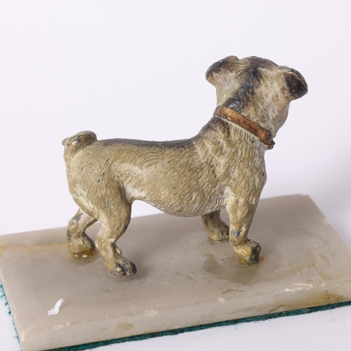 11 - A painted spelter study of a standing Pug dog, with gilded collar, H6cm, mounted on an alabaster pan... 