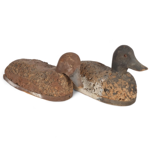 114 - A pair of Antique duck decoys, with cork bodies and painted wood heads, tallest 21cm
