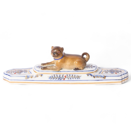13 - Meissen, a 19th century porcelain Pug dog paperweight, on stepped base, with a blue and gilt collar,... 