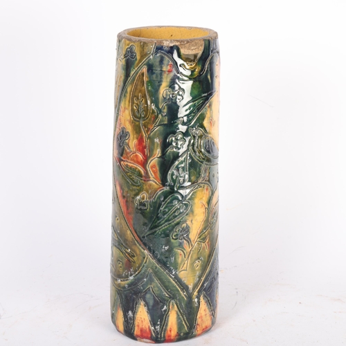130 - A Continental pottery cylinder vase, painted body with incised bird and floral decoration, H29cm