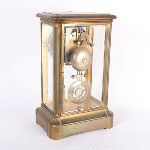 145 - A brass-cased 4-panelled glass bell striking 8-day mantel clock, by J Foord Hastings, enamel dial an... 