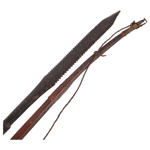 173 - An African bow and an African hardwood spear, L127cm