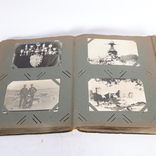 207 - An album containing various early 20th century Naval postcards, including loading horses, 2 with hum... 