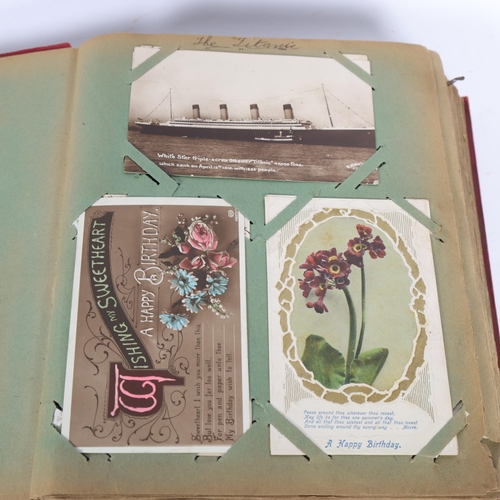 211 - A Vintage postcard album, containing various topographical, scenic, humorous postcards, greeting car... 