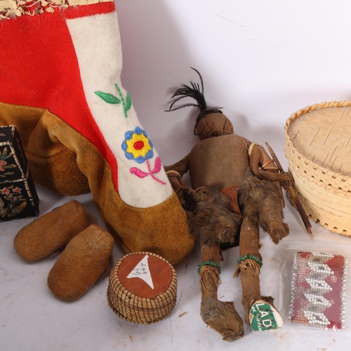 213 - An Antique Inuit brown paper and cloth covered doll, a single Inuit boot, beadwork band, pair of min... 