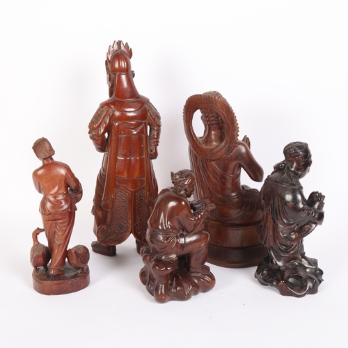 240 - A group of modern hardwood carved Oriental and other figures, including a seated Buddha, and Chinese... 