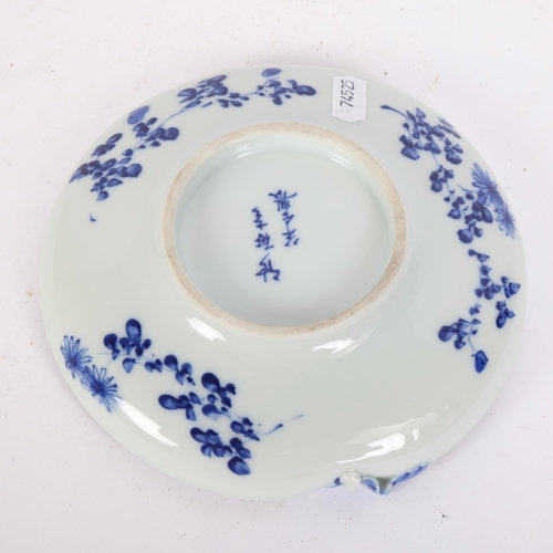 249 - A Chinese blue and white peach-shaped dish, with decorative lip and floral decoration, 6 character m... 