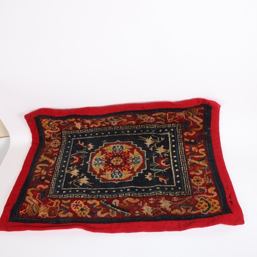 280 - A selection of Ethnic textiles, to include various Persian rugs, largest 70cm x 53cm, a camel bag wi... 