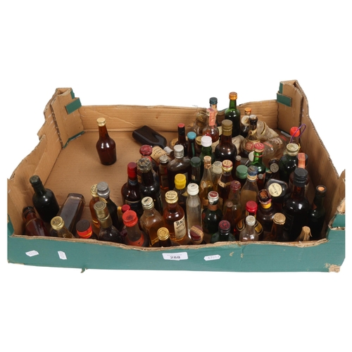 288 - A large selection of alcoholic miniatures, various Whiskys Gins etc