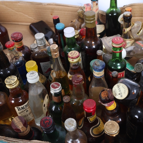 288 - A large selection of alcoholic miniatures, various Whiskys Gins etc