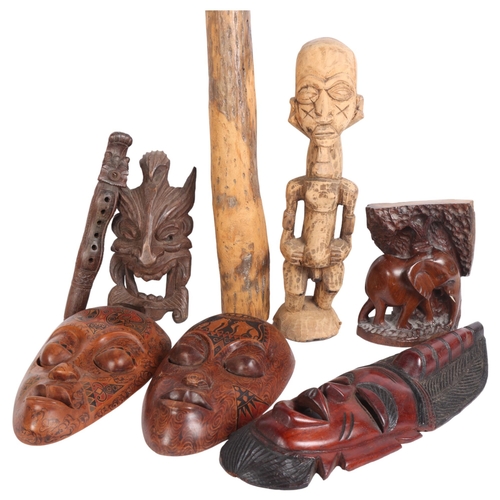 289 - A selection of modern hardwood tourist items, including a hardwood statue of a fertility God, variou... 