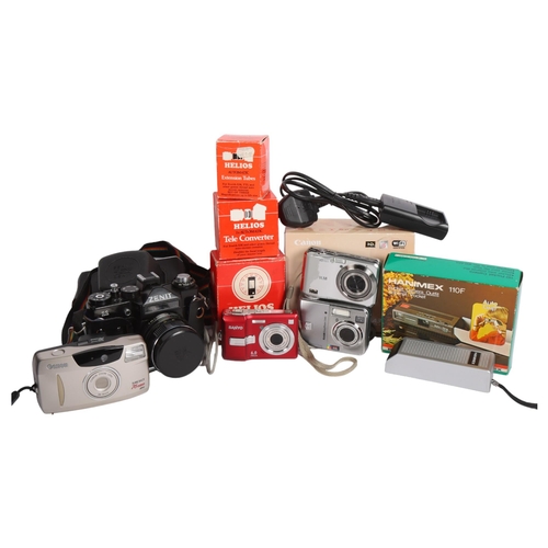 310 - A selection of Vintage cameras and associated accessories, including a Zenit 11, a Hanimex 110F pock... 