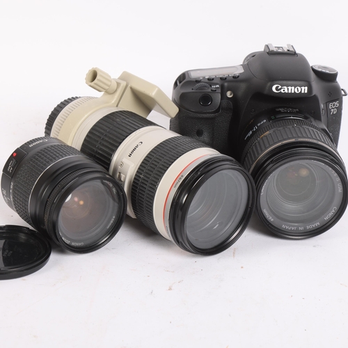 313 - A Canon EOS 7D digital camera, with associated Canon zoom lens EF-S17-85mm, a further Canon zoom len... 