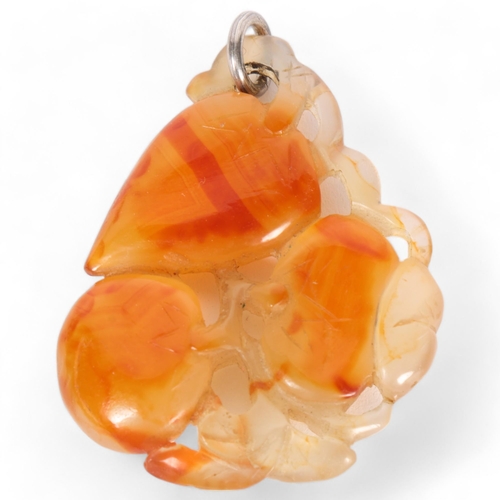36 - A Chinese carved carnelian agate fruit pendant, L5.5cm