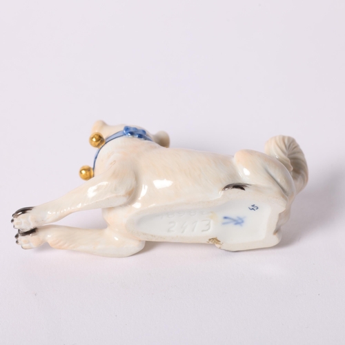4 - Meissen, a porcelain figure of a seated Pug, with a blue and gilt studded collar, L7.5cm, blue cross... 
