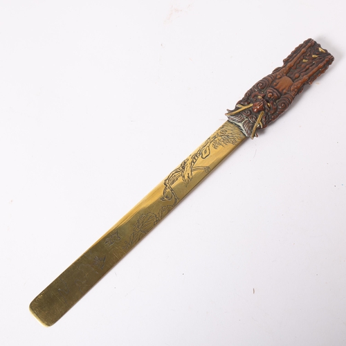 54 - A Japanese engraved and embossed brass page turner/letter opener, 31cm