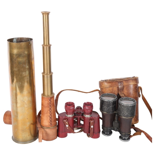 555 - Delacroix Paris red 8x25 binoculars, a leather-case pair of Antique binoculars, a leather-cased bras... 