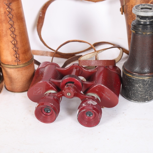 555 - Delacroix Paris red 8x25 binoculars, a leather-case pair of Antique binoculars, a leather-cased bras... 