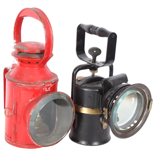 558 - A Crestella Premier railway oil lantern, and a red painted London Transport lantern, initialled LT, ... 