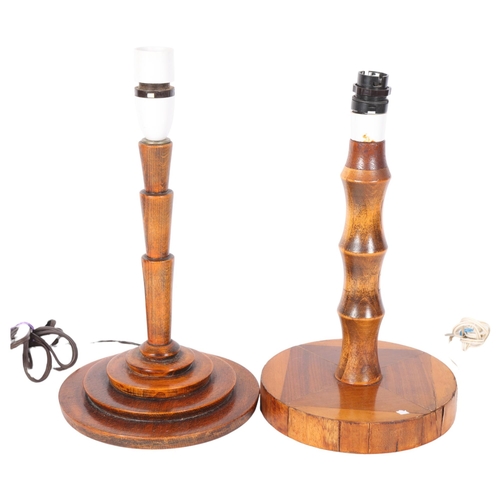 562 - An Art Deco oak table lamp on stepped plinth, 34cm, and another wooden lamp