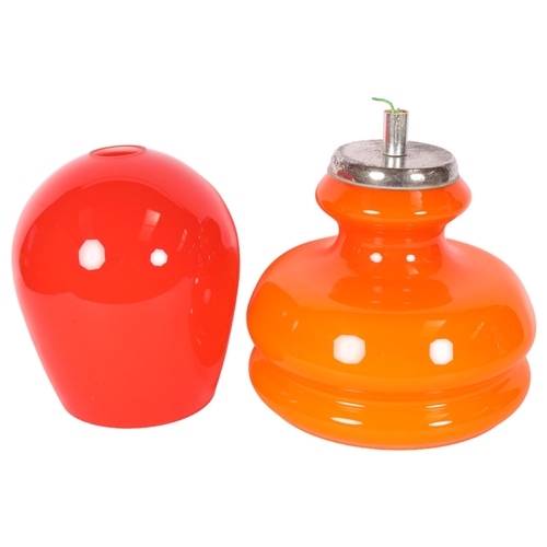 563 - A red Holmegaard glass pendant lamp, and an orange glass pendant lamp with fitting, H25cm