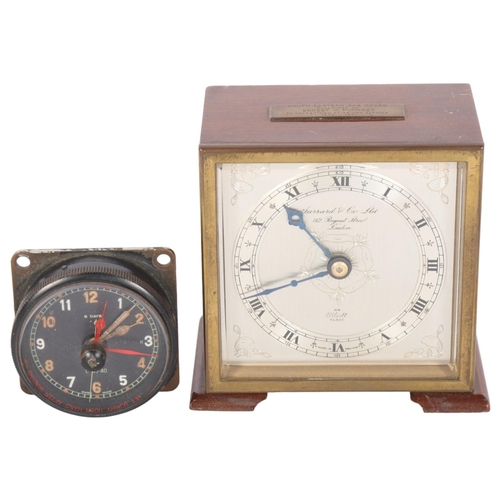 570 - A small Garrard's key-wind mantel clock, with presentation plaque dated 1971, H11cm, and a wall-moun... 