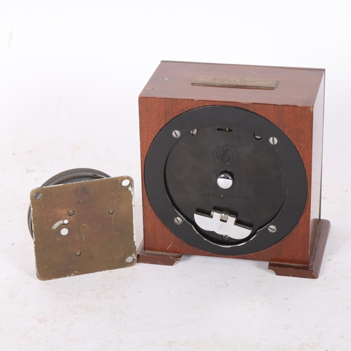 570 - A small Garrard's key-wind mantel clock, with presentation plaque dated 1971, H11cm, and a wall-moun... 