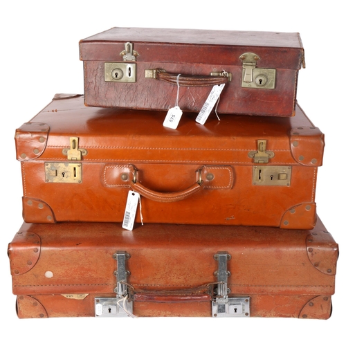 575 - A group of 3 suitcases, including a Vintage leather case, L61cm, a Revelation case, and a small leat... 