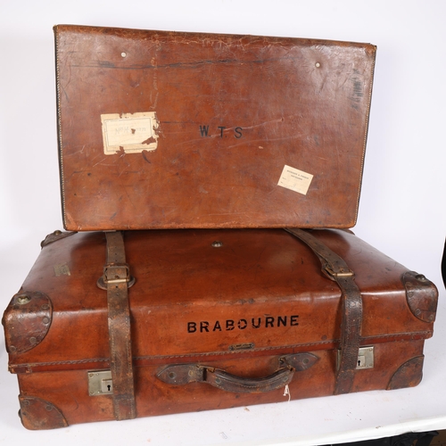 576 - A Brabourne leather trunk, 82cm across, and a smaller leather suitcase with straps