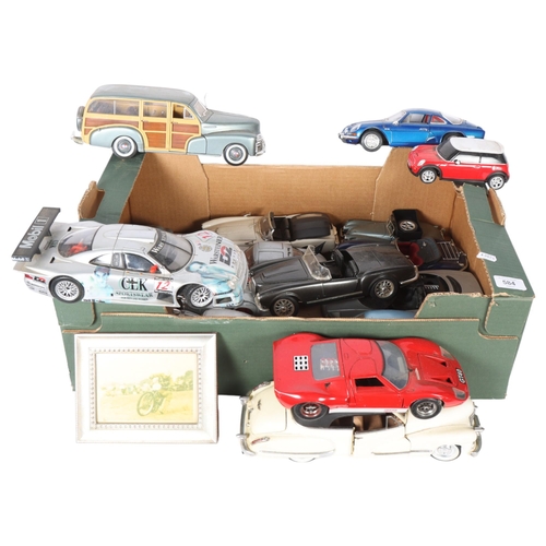 584 - A collection of diecast vehicles, including a Burago Mercedes 300SL, a Maisto Jaguar Mk II, a Maisto... 