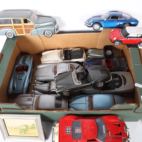 584 - A collection of diecast vehicles, including a Burago Mercedes 300SL, a Maisto Jaguar Mk II, a Maisto... 