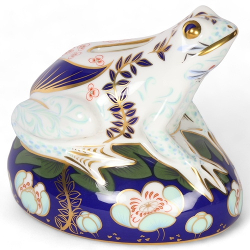 73 - Royal Crown Derby, a frog on a lily pad paperweight, frog money box, H11cm