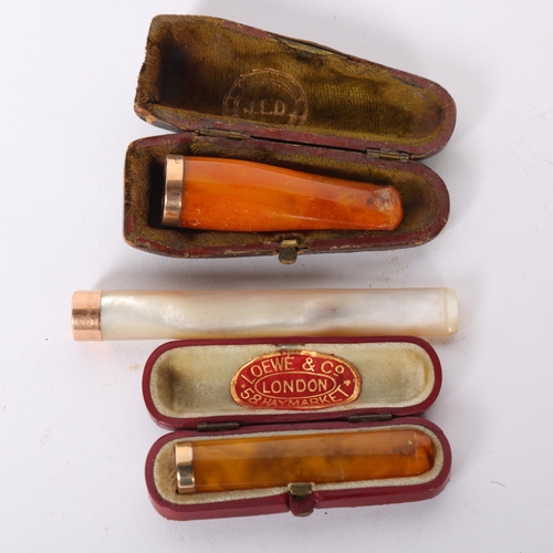 78 - A large mother-of-pearl and 15ct gold mounted cigarette holder, and 2 amber and 9ct gold mounted cig... 