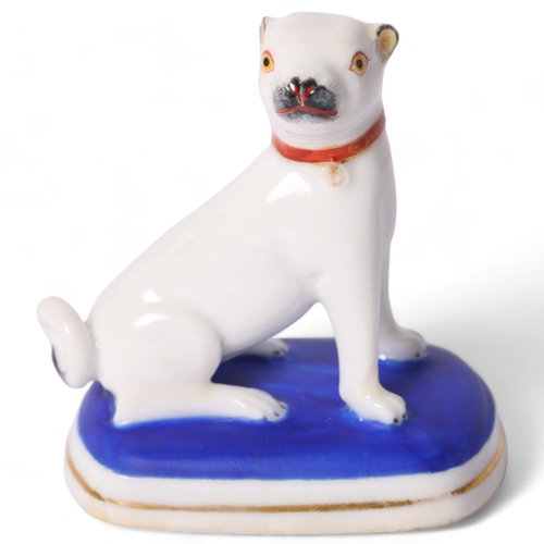 8 - A Chamberlain's Worcester model of a Pug dog, seated on its haunches, with red collar, on a blue and... 