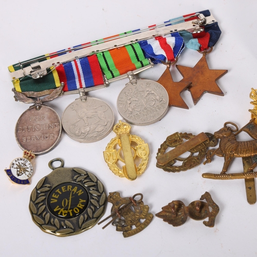 84 - A group of 4 Second World War medals, including the France and Germany Star, and a George V Efficien... 