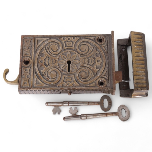 87 - An Antique cast-metal lock, geometric decorated, with 3 keys
