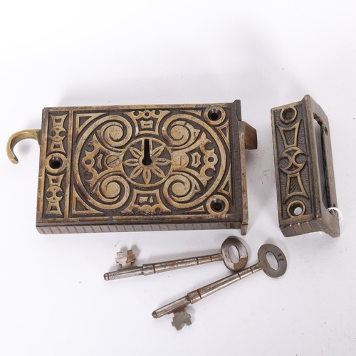 87 - An Antique cast-metal lock, geometric decorated, with 3 keys