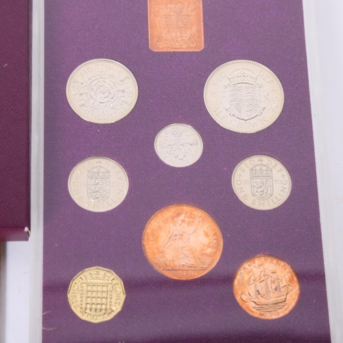 93 - A 1970 commemorative presentation pack of coins, together with 4 American 1964 half dollars