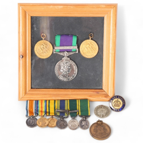 99 - A group of various medals, including 2 British military polytechnic? Harriers medals, in a glazed fr... 