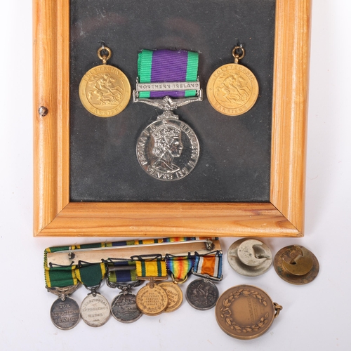 99 - A group of various medals, including 2 British military polytechnic? Harriers medals, in a glazed fr... 