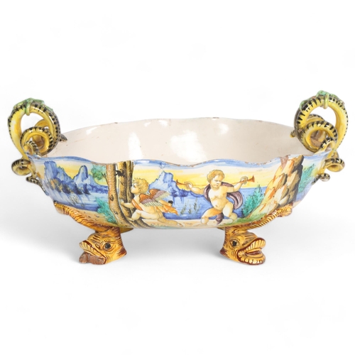 797 - Ulisse Cantagalli, 19th century Majolica oval table centre bowl, on mythical fish feet, W40cm