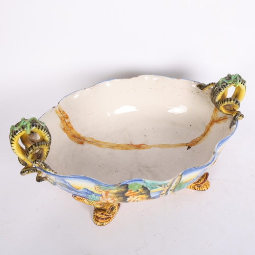 797 - Ulisse Cantagalli, 19th century Majolica oval table centre bowl, on mythical fish feet, W40cm