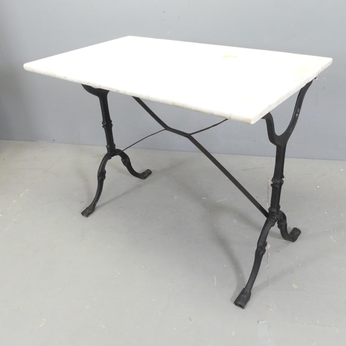 2675 - A rectangular dry marble-topped garden table on cast iron frame. 89x71x53cm.