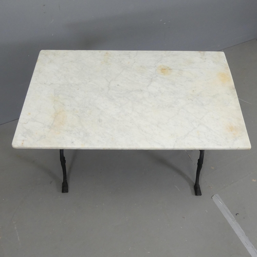 2675 - A rectangular dry marble-topped garden table on cast iron frame. 89x71x53cm.